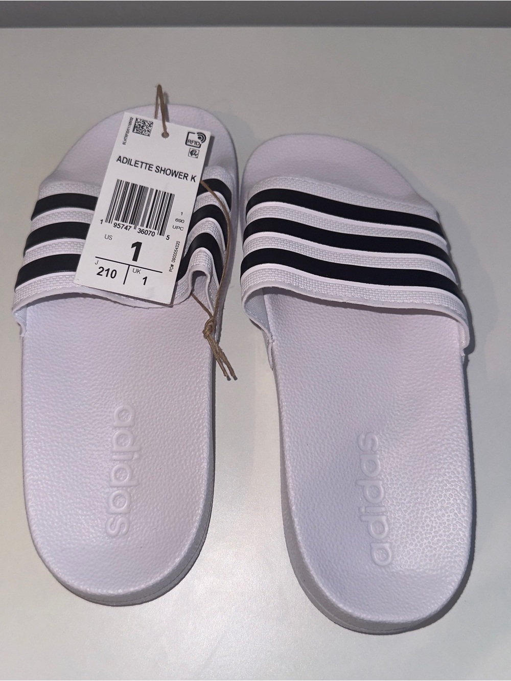 adidas Kids Adilette Shower Slide Sandals in White with Black Stripes